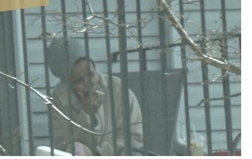 Surveillance photo of Rep. Omar smoking on her Washington D.C. balcony